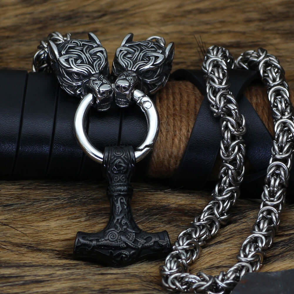 Braided King Chain With Twin Wolf Heads Holding A Mjolnir Pendant