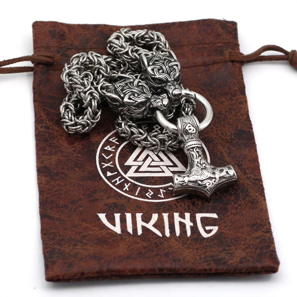Braided King Chain With Twin Wolf Heads Holding A Mjolnir Pendant