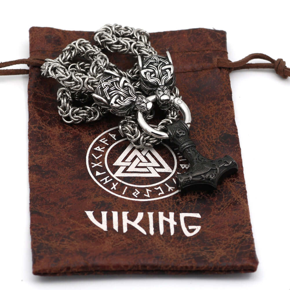 Braided King Chain With Twin Wolf Heads Holding A Mjolnir Pendant
